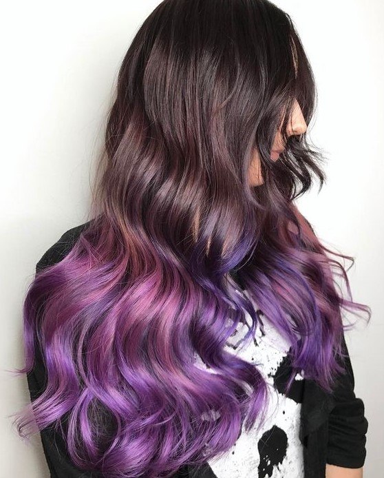 long dark hair with purple and pink ombre, with waves is a chic and bold idea that will make a statement
