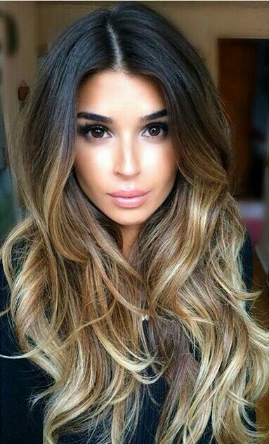 long ombre hair from black to golden blonde and bronde, with layers, waves and volume is amazing