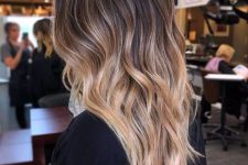 long ombre hair from dark brunette to caramel and golden blonde, with layers and waves is wow