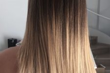 long ombre hair from dark brunette to golden blonde, with a lot of volume and straight hair is amazing