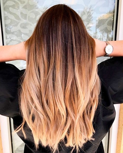 long straight volumetric hair from brunette to caramel and golden blonde, with messy waves is amazing