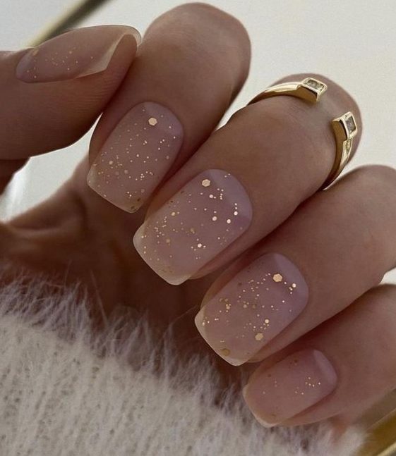 matte nude nails with rose gold glitter and gold sparkles are amazing for NYE, they will add a delicate touch of shine