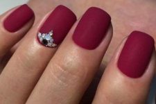 matte red nails with colorful rhinestones for an accent are geat for the fall and winter or Christmas