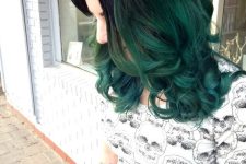 medium-length black hair with green ombre, volume and waves is an adorable and eye-catchy solution