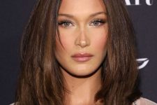 medium-length chocolate brown hair with caramel balayage and curled ends plus volume is a chic idea