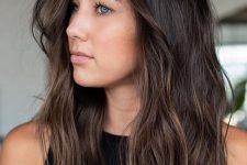 medium-length dark brown hair of a cold shade, with slight balayage for an accent and messy texture is a super cool idea