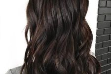 medium-length dark brown hair with waves and volume is a catchy and bold solution to rock, it looks gorgeous