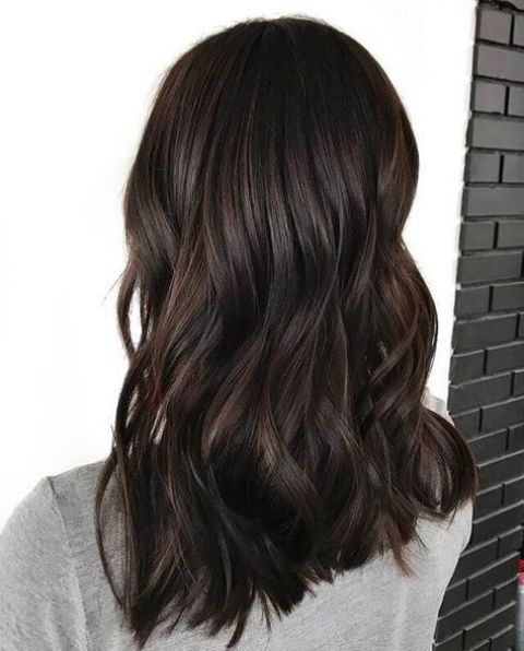 Medium length dark brown hair with waves and volume is a catchy and bold solution to rock, it looks gorgeous