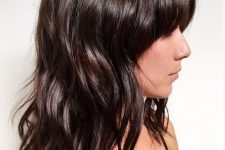medium-length dark brown hair with waves down and some bangs is a catchy idea, add a shiny touch to the look