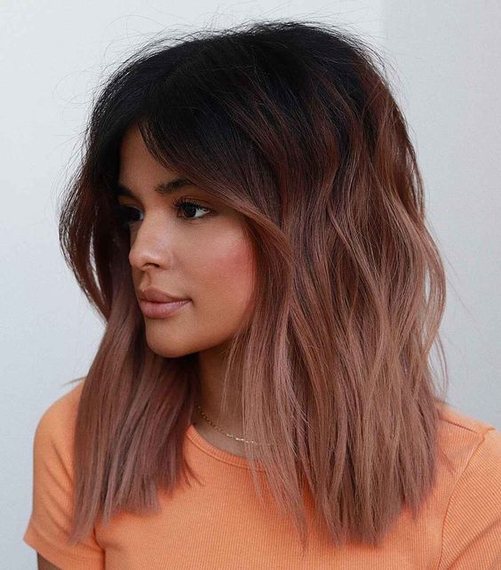 medium-length dark brunette to light chestnut hair with a lot of volume and texture and some waves is adorable