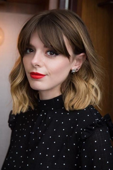 medium-length hair from brown to bronde, with waves and bottleneck bangs is a stylish idea