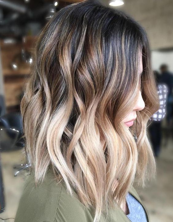 medium-length ombre hair drom deep brown to blonde, with volume and waves, is fantastic