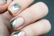 negative space nails with silver glitter and gold sticker stripes are amazing if you like nude nails with some designs