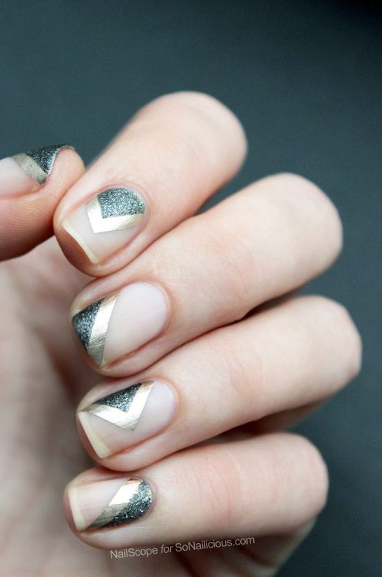 negative space nails with silver glitter and gold sticker stripes are amazing if you like nude nails with some designs