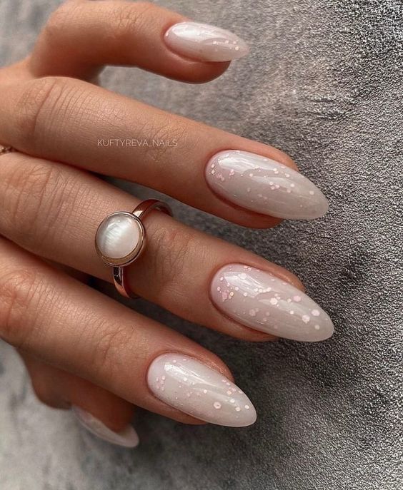 nude almond nails with pink glitter are a delicate and chic solution for every bride who loves neutrals
