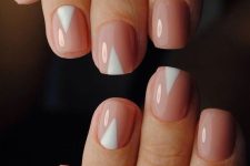 nude nails with white geometric touches for a bold and trendy modern look
