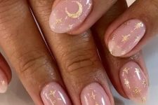 nude wedding nails accented with glitter stars and half moons are amazing for a celestial bride