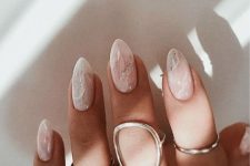 nude wedding nails with an icry touch and silver glitter are adorable for a chic and lovely look