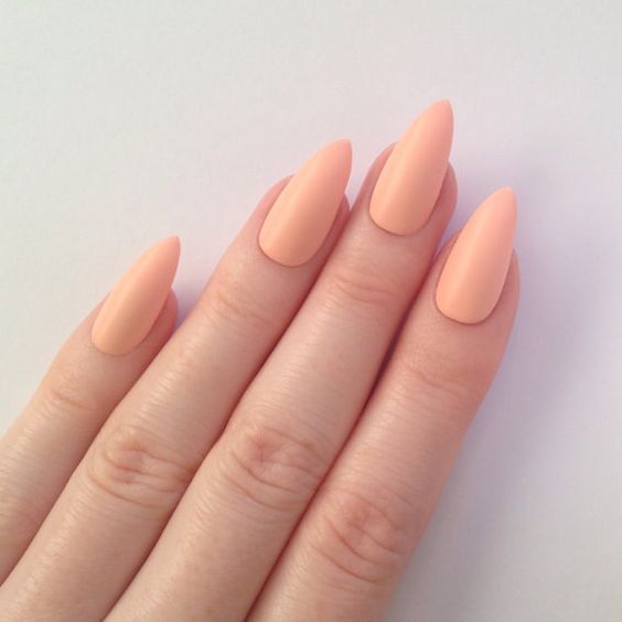 pointed matte peachy nails are a delicate solution for a manicure, and that pointed shape will make them unique
