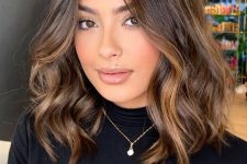 pretty dark brown shoulder-length hair with caramel balayage and waves is amazing