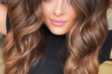 pretty long dark brunette hair to caramel, with waves, is a chic and catchy idea to rock, ombre effect adds interest