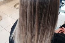 pretty medium to long hair with an ombre effect from light brunette to cold icy blonde