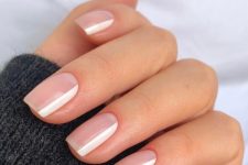 short nude nails with white stripes are a cool version of French manicure, they will match any outfit