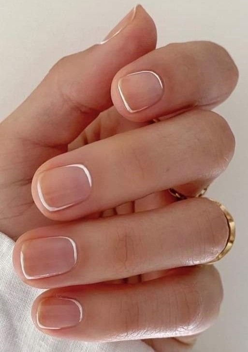 short square nude nails with white touches are a cool solution if you like French nails but not traditional ones