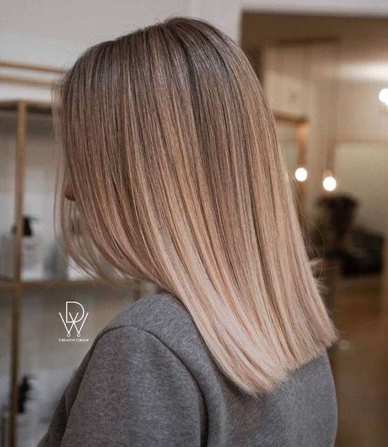 shoulder-length hair with a delicate ombre, from bronde to bleached blonde, with straight hair is wow