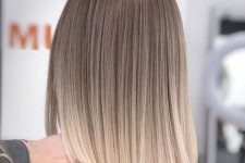 shoulder-length straight ombre hair from bronde to blonde is a super chic and delicate idea