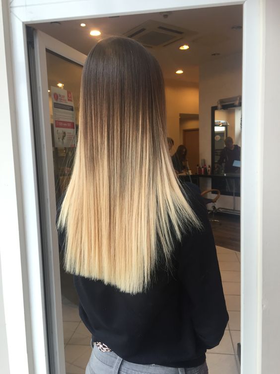 straight long ombre hair from dark brunette to bright warm blonde is a cool and catchy solution to rock