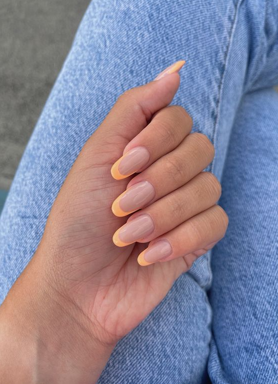 a lovely Peach Fuzz French manicure of an almond shape is a super cool and catchy idea to rock