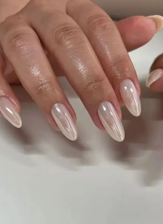 delicate soft neutral chrome nails, long and of an almond shape, will be a gorgeous solution for a a neutral and refined look