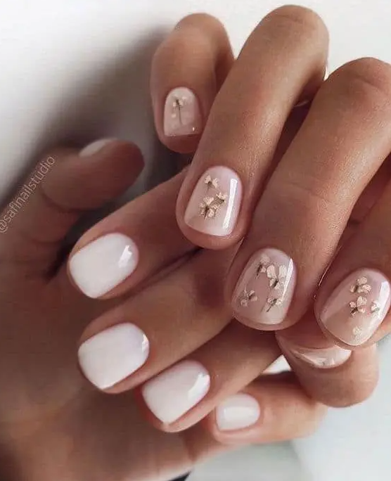 white and nude neails with little gold flowers is a stylish and beautiful spring wedding manicure you can try