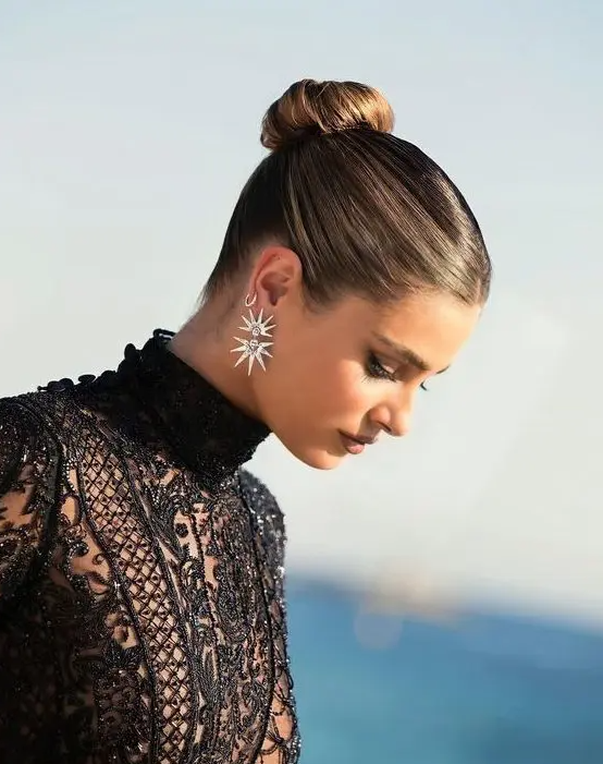 an elegant top knot with a sleek top is always a good that works for most of styles, a perfect updo