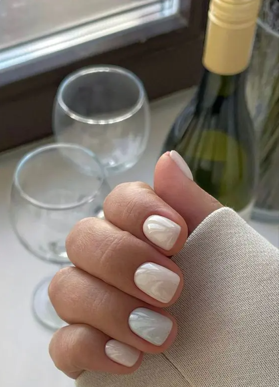 a super delicate pastel wedding manicure done in tan and light green shades is a great idea for a spring bride