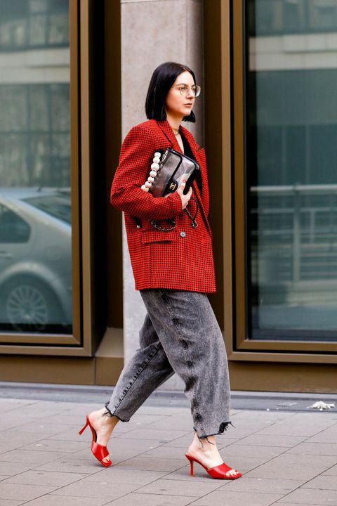 a bold cherry red oversized blazer, grey wideleg jeans, cherry red mules and a bold bag are a super trendy solution