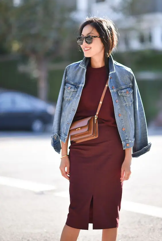 a burgundy jumper, a matching midi pencil skirt, a blue denim jacket and a beige bag to wear right now