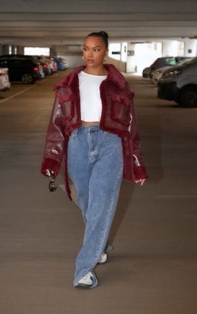 A cherry red cropped shearlign coart, blue jeans, a white t shirt, white sneakers are a lovely combo for winter