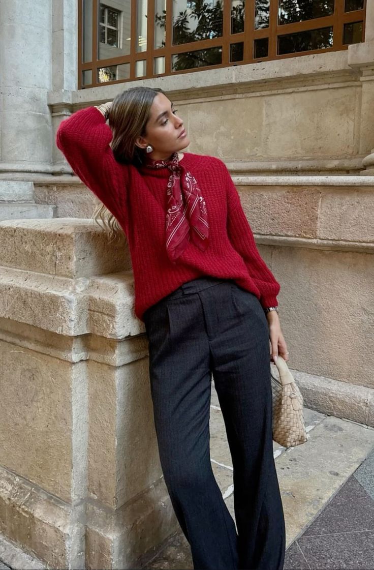 a cherry red sweater, soot pants, a red cherry scarf and a neutral woven bag are lovely for winter