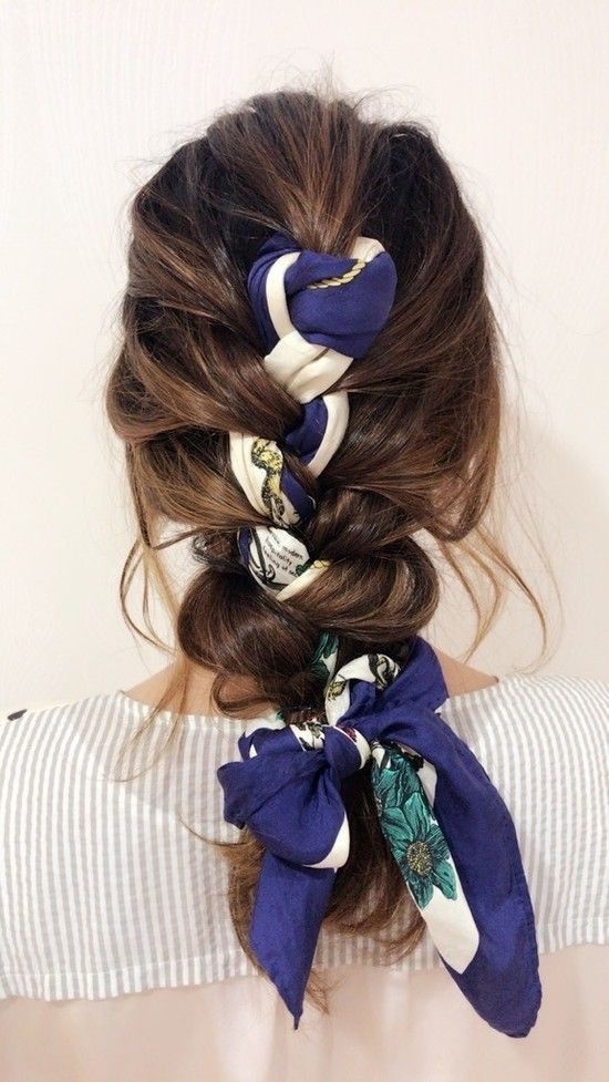 a high braid with a messy top and a bright printed scarf interwoven are a lovely and bold combo to try right now