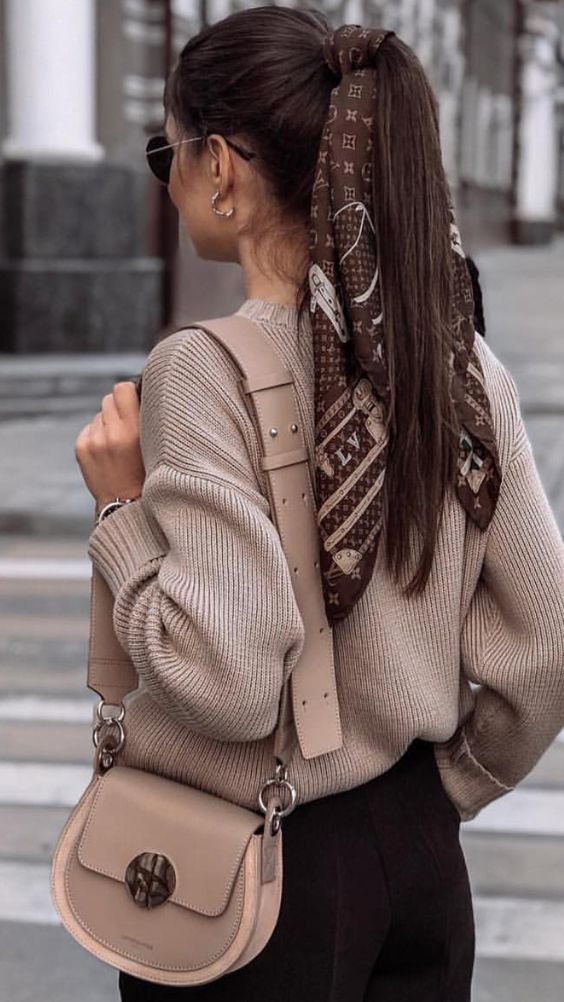 a high long ponytail with a volumetric top and a brown printed scarf for an accent is a catchy and cool idea