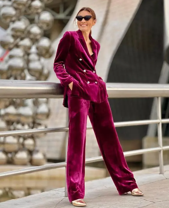 a magenta velvet pantsuit and gold shoes will be a fantastic combo for a special occasion