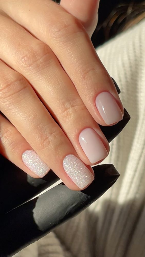 a milky manicure with two accent nails with blong is amazing, these are wedding-worthy nails
