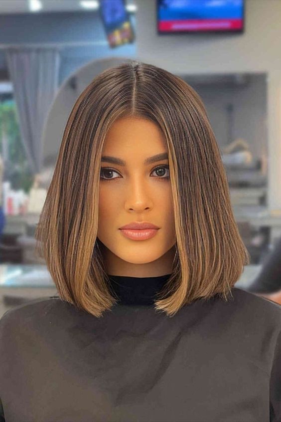 a perfect brunette midi bob with very subtle caramel contouring and curled ends is amazing and never goes out of style