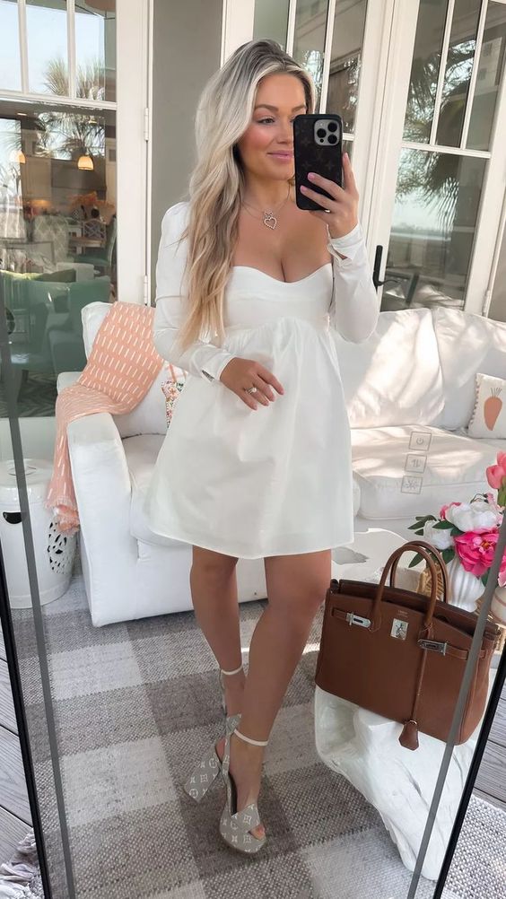 a simple plain A-line mini dress with a sweetheart neckline and grey pritned platform shoes are a cool spring bridal shower look