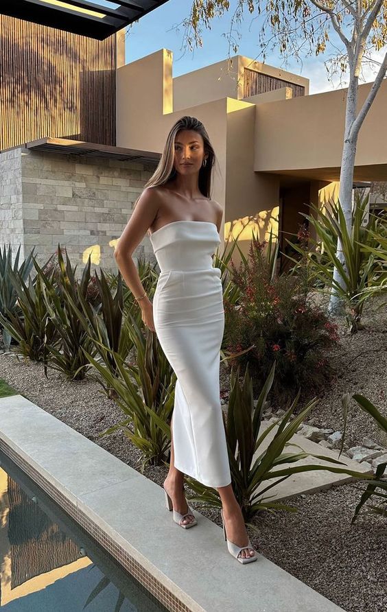 A stylish fitting off the shoulder midi dress and off white mules are a cool combo for a spring or summer bridal shower