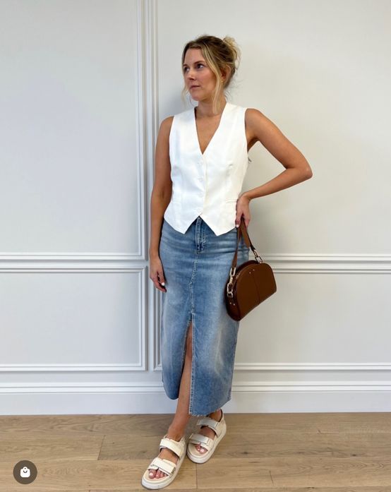 a white waistcoat, a blue denim midi, neutral sandals and a burgundy bag are great for summer