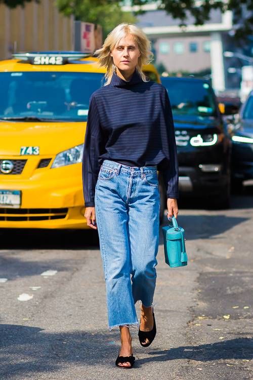 An eye catchy look with a navy long sleeve top, blue boyfriend jeans, black peep toe shoes and a turquoise bag