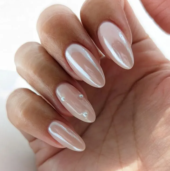 chic pearly glazed donut nails with pearls for an accent can be a nice solution for a wedding